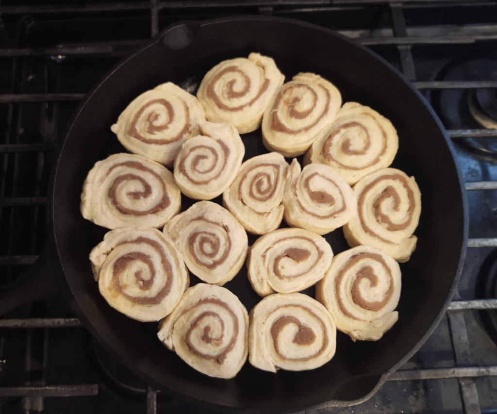 sourdough cinnamon roll dough on cast iron