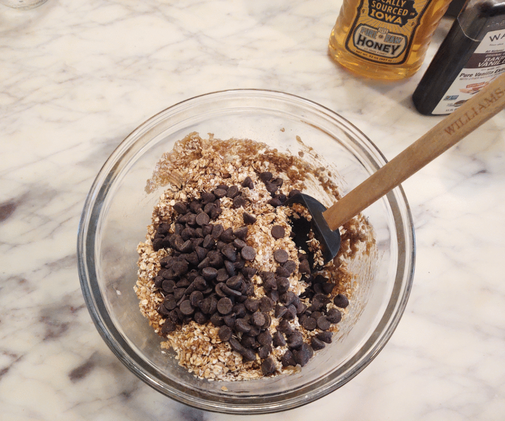 adding chocolate chips to bars