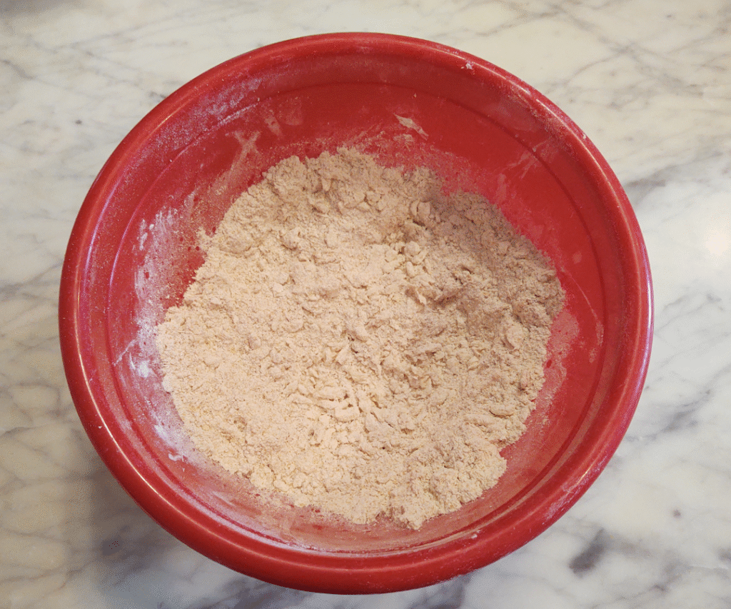 blending butter into soft white wheat flour