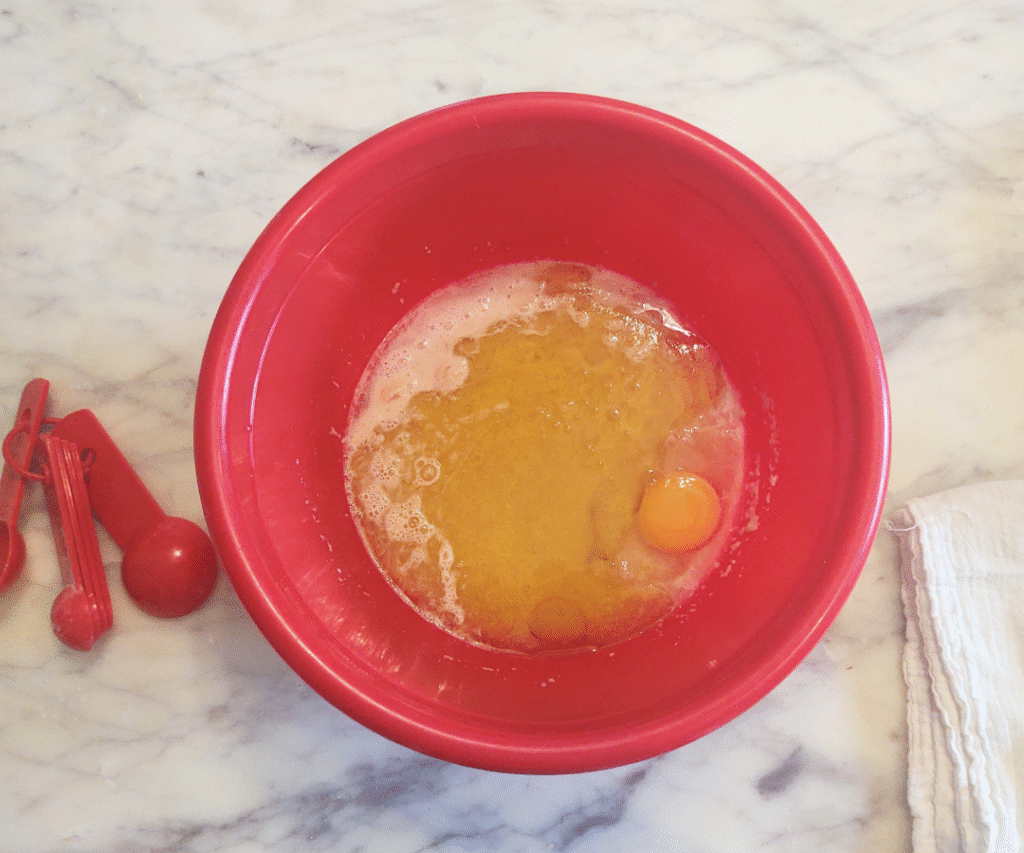add oil, egg and salt to yeast honey water