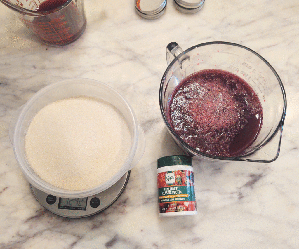 measured sugar, juice and pectin for jelly