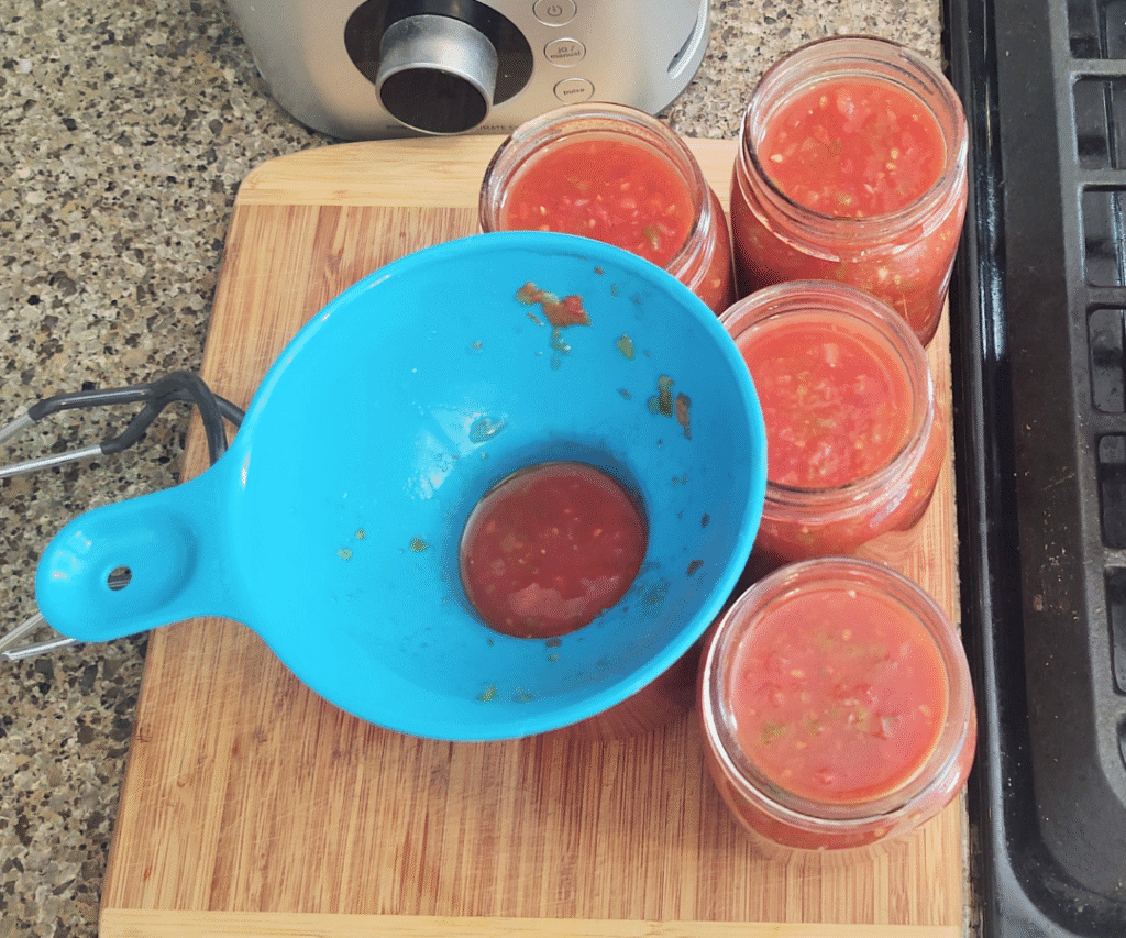 pour salsa into jars