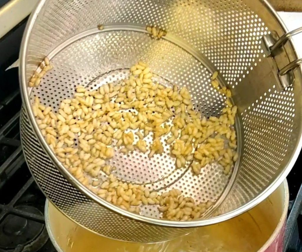 straining puffed rice